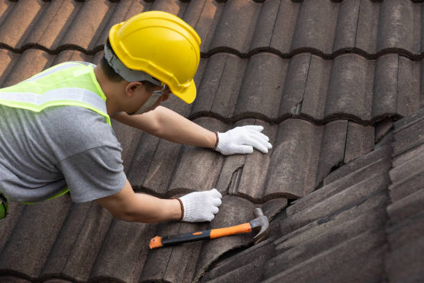 SwiftFix | Emergency Roof Repair in Birmingham Worker man replace tile of the old roof. Repair roof concept.